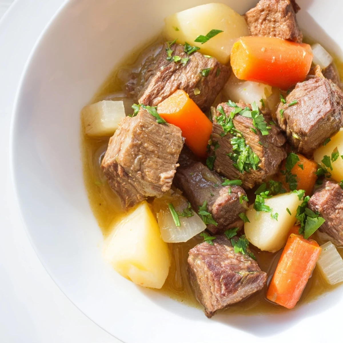Rustic Dutch oven filled with Lamb Stew with Root Vegetables, showcasing seared lamb and vibrant root vegetables.