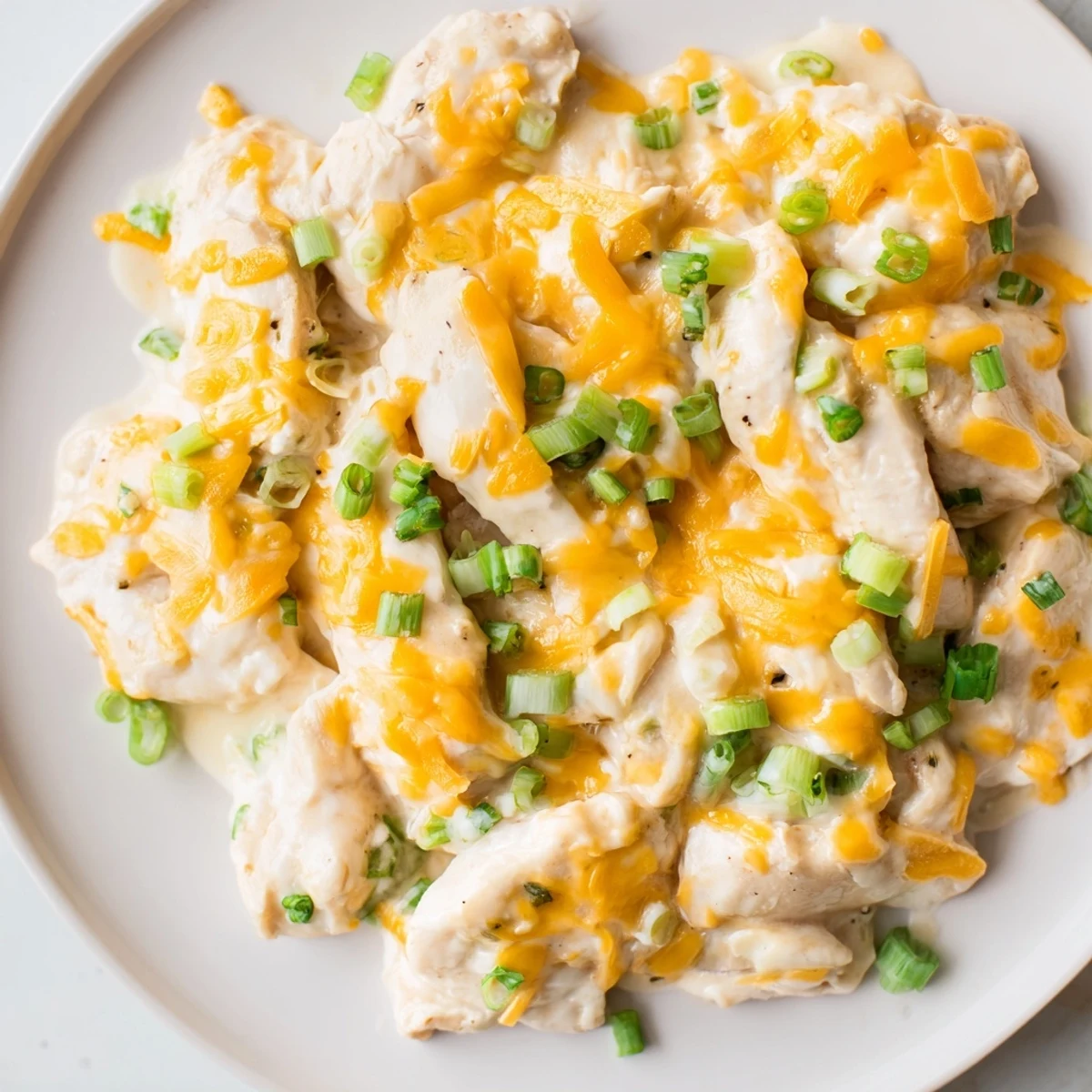 Sour Cream and Onion Chicken fresh from the oven, garnished with chopped green onions for a flavorful weeknight dinner.