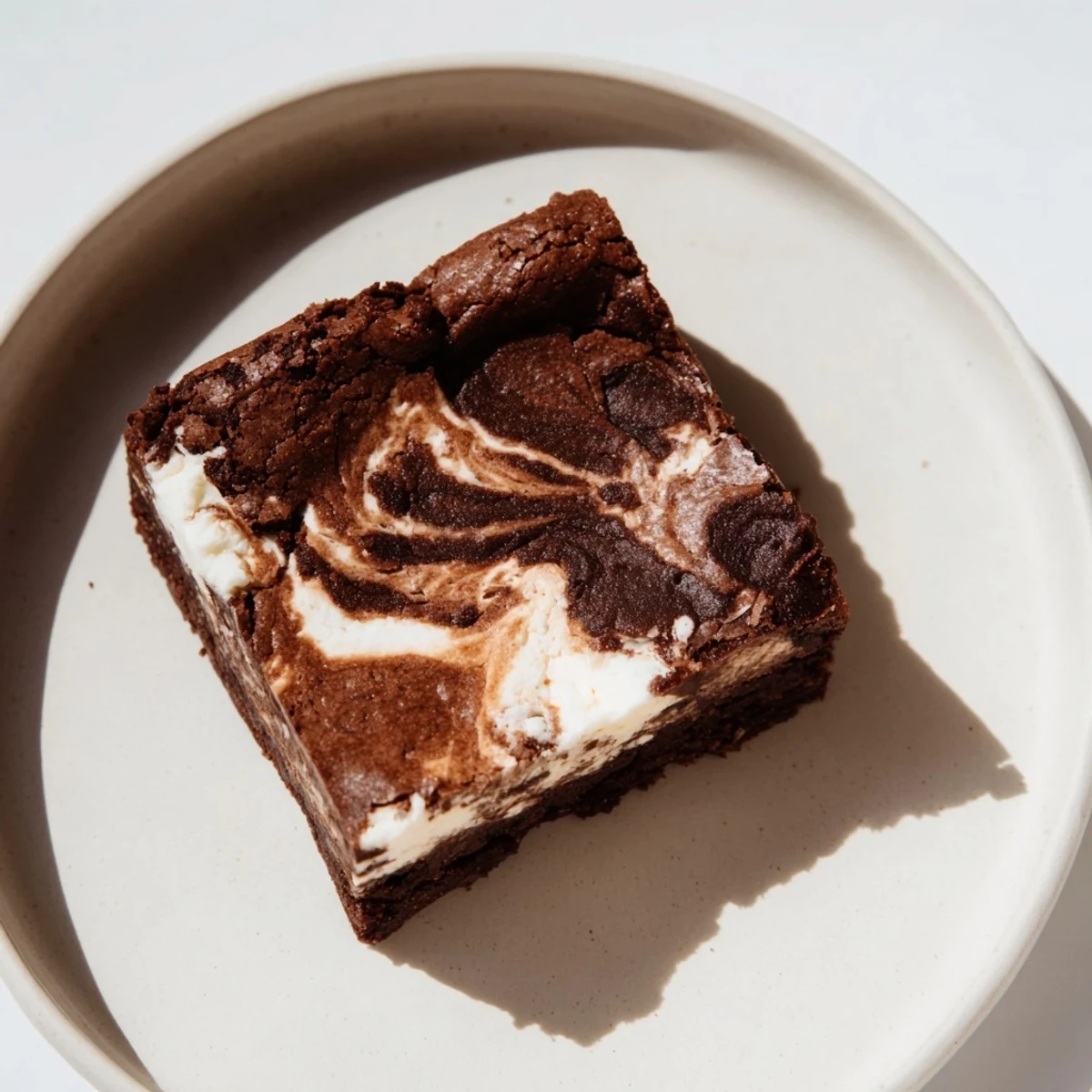 Warm, fudgy Cottage Cheese Brownies with a creamy, tangy swirl and a rich chocolate glaze.
