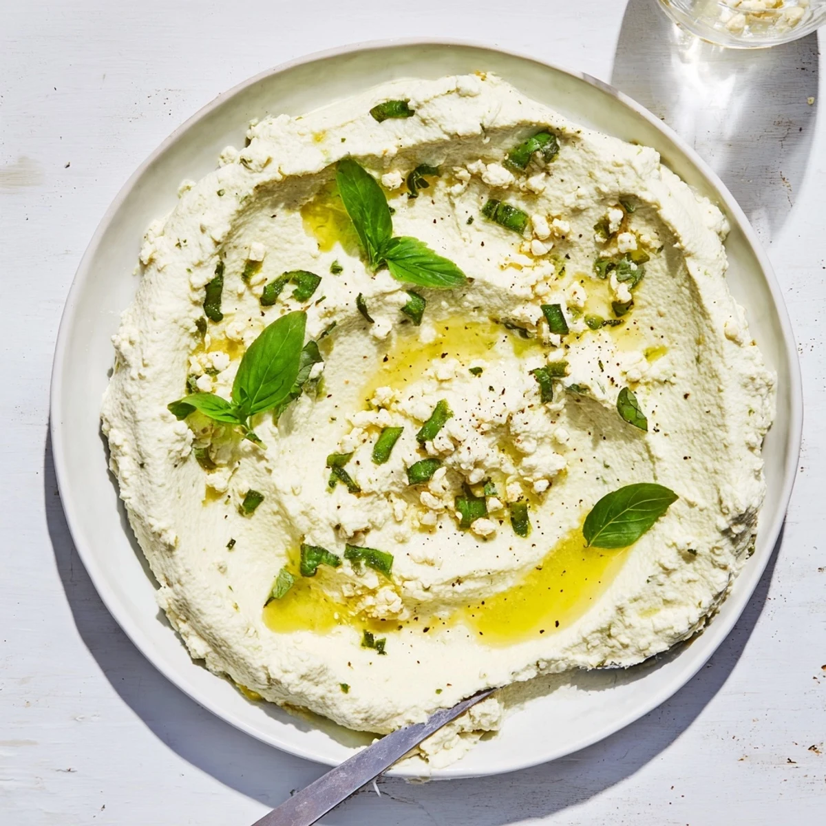 Tofu ricotta with lemon zest and olive oil, perfect for dairy-free stuffed shells.