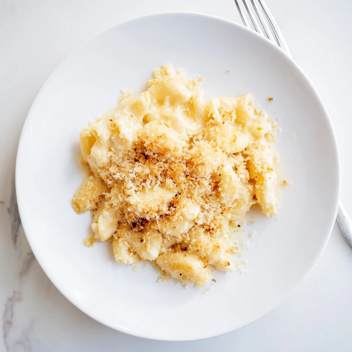 Baked Boursin mac and cheese featuring melted cheddar and herbed cheese over tender elbow pasta