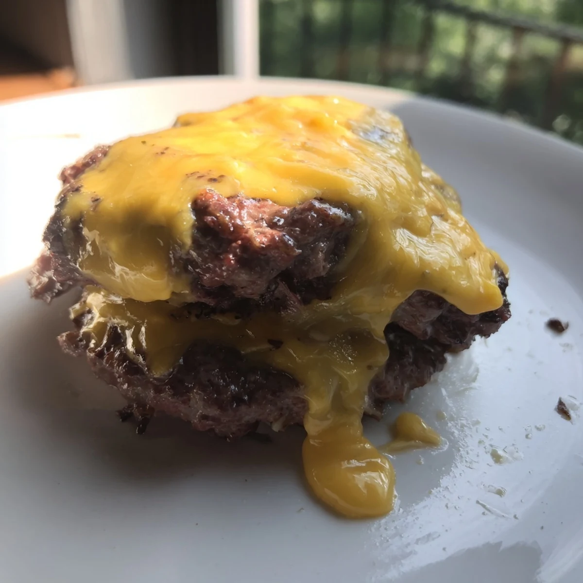 Perfectly cooked air fryer hamburger patties featuring juicy beef with a crispy exterior and center indentation
