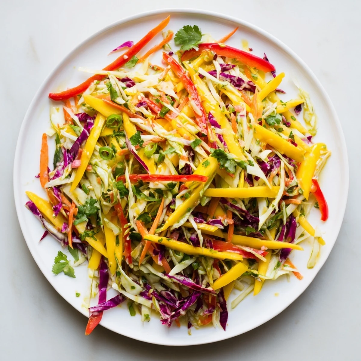 Vibrant mango slaw featuring colorful shredded cabbage crisp vegetables zesty lime dressing