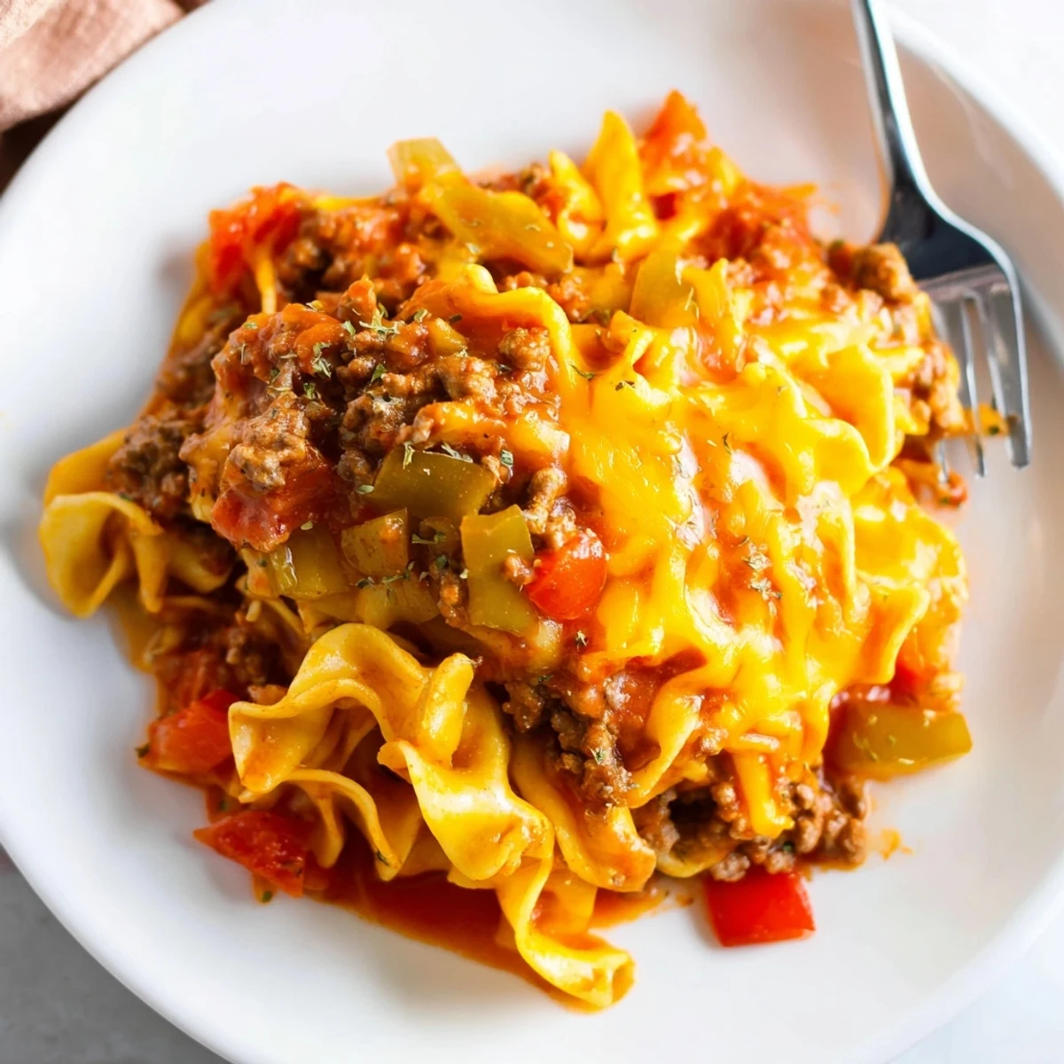 Warm Beef Noodle Casserole served with garlic bread and crisp salad