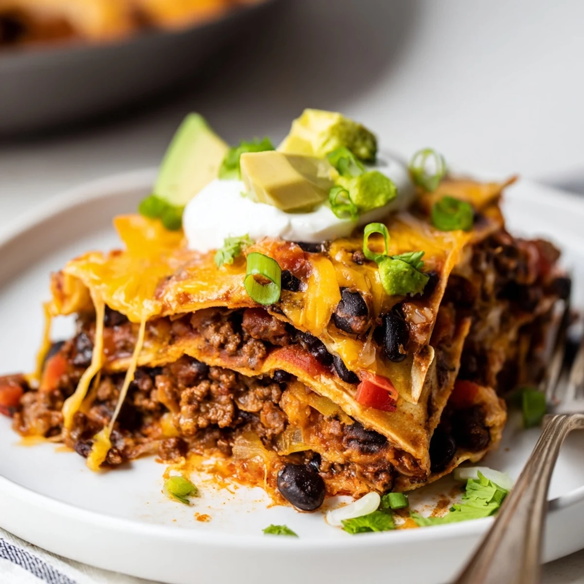 One-pan Beef Skillet Enchiladas sizzling in cast-iron, ready for a scoop