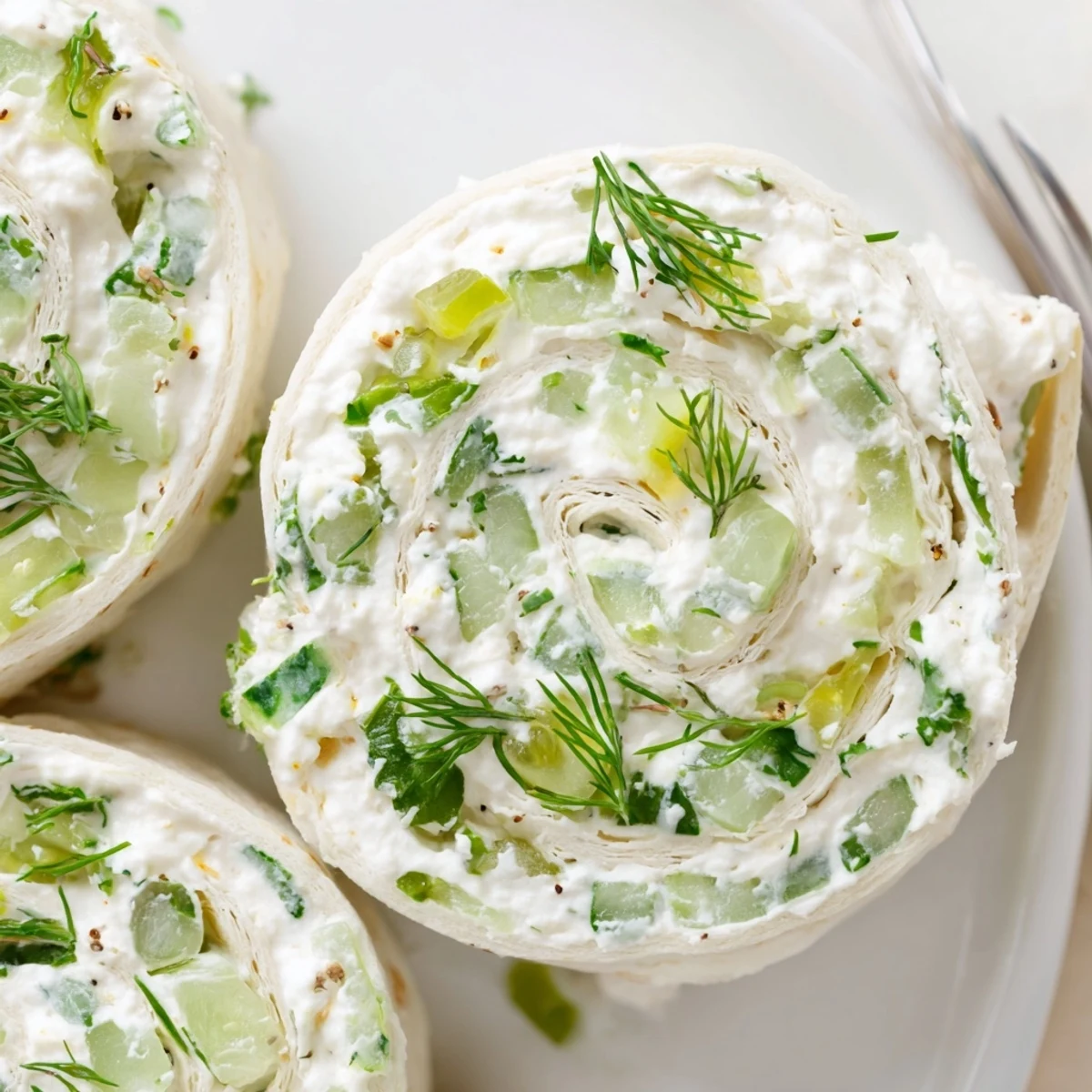 Chilled Pickle Dip Pinwheels sliced into bites, soft tortillas and tangy pickles  