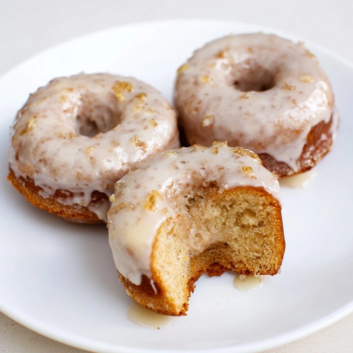 Homestyle Banana Donuts sliced open to show fluffy, cake-like interior and steam