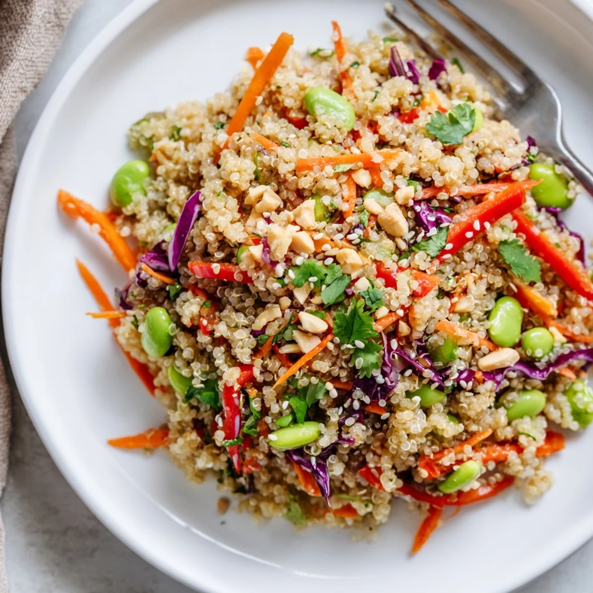 Bright Asian Dressing Quinoa Salad tossed with sesame, peanuts, and fresh cilantro.