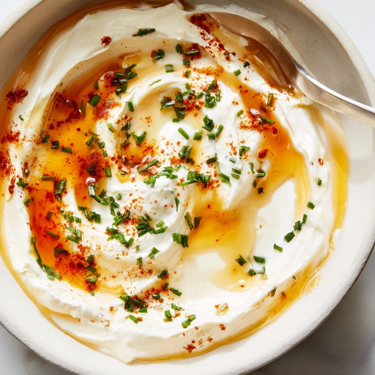 Zesty Hot Honey Ranch Dip drizzled with honey, served with crisp fries.