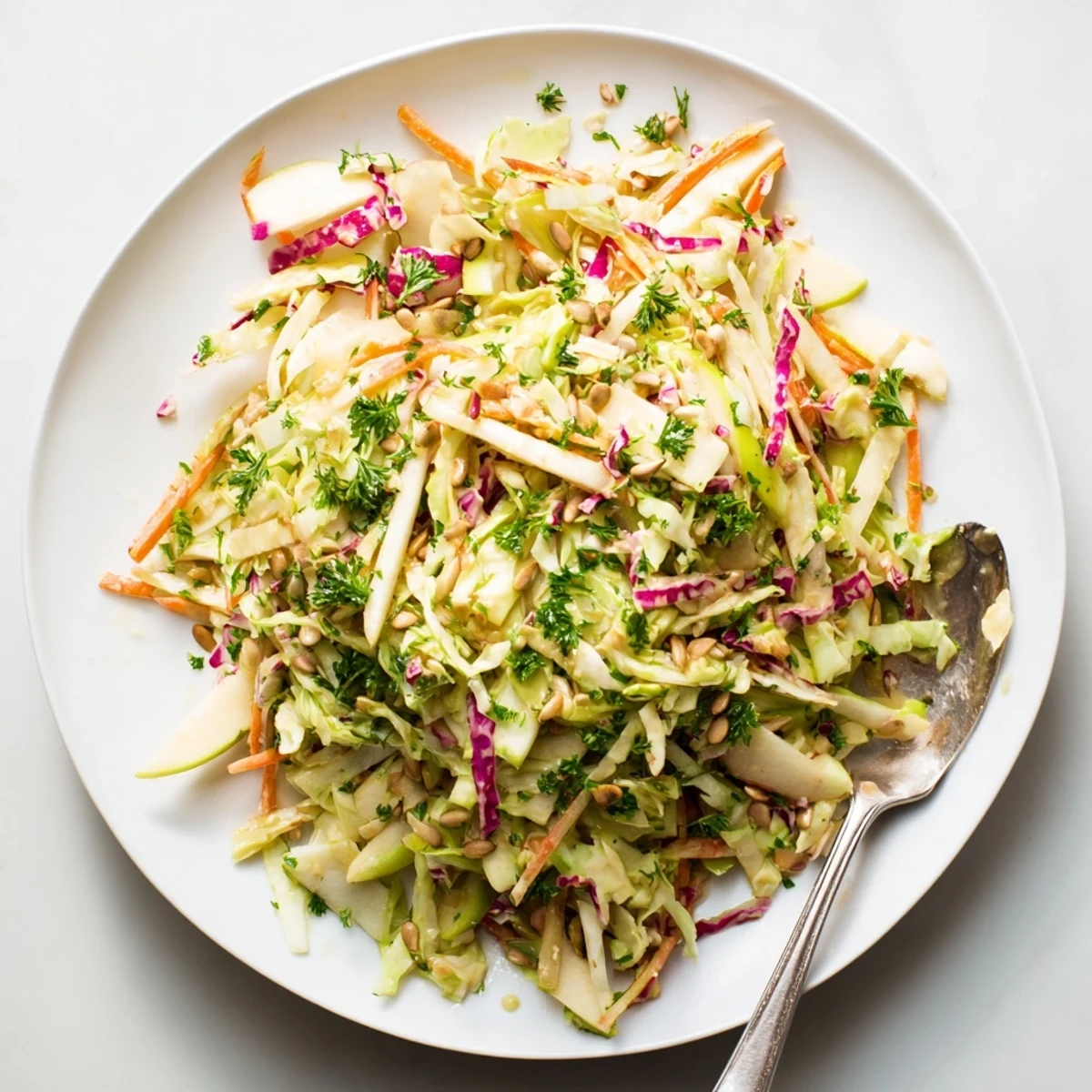 Fresh apple coleslaw with crunchy green and red cabbage in creamy honey-mustard dressing