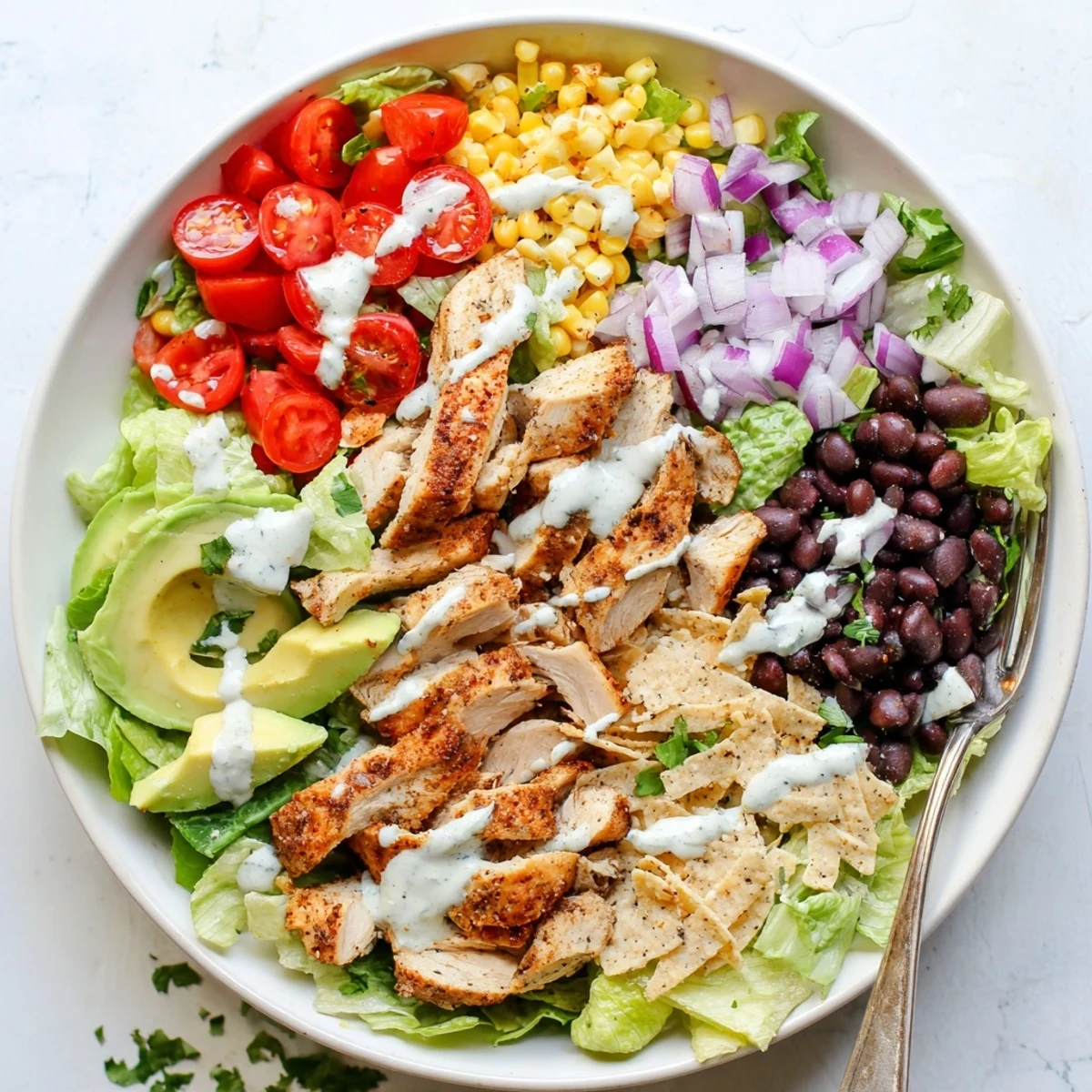 Hearty Southwestern chicken salad with juicy spiced chicken, vibrant vegetables, and tangy yogurt dressing