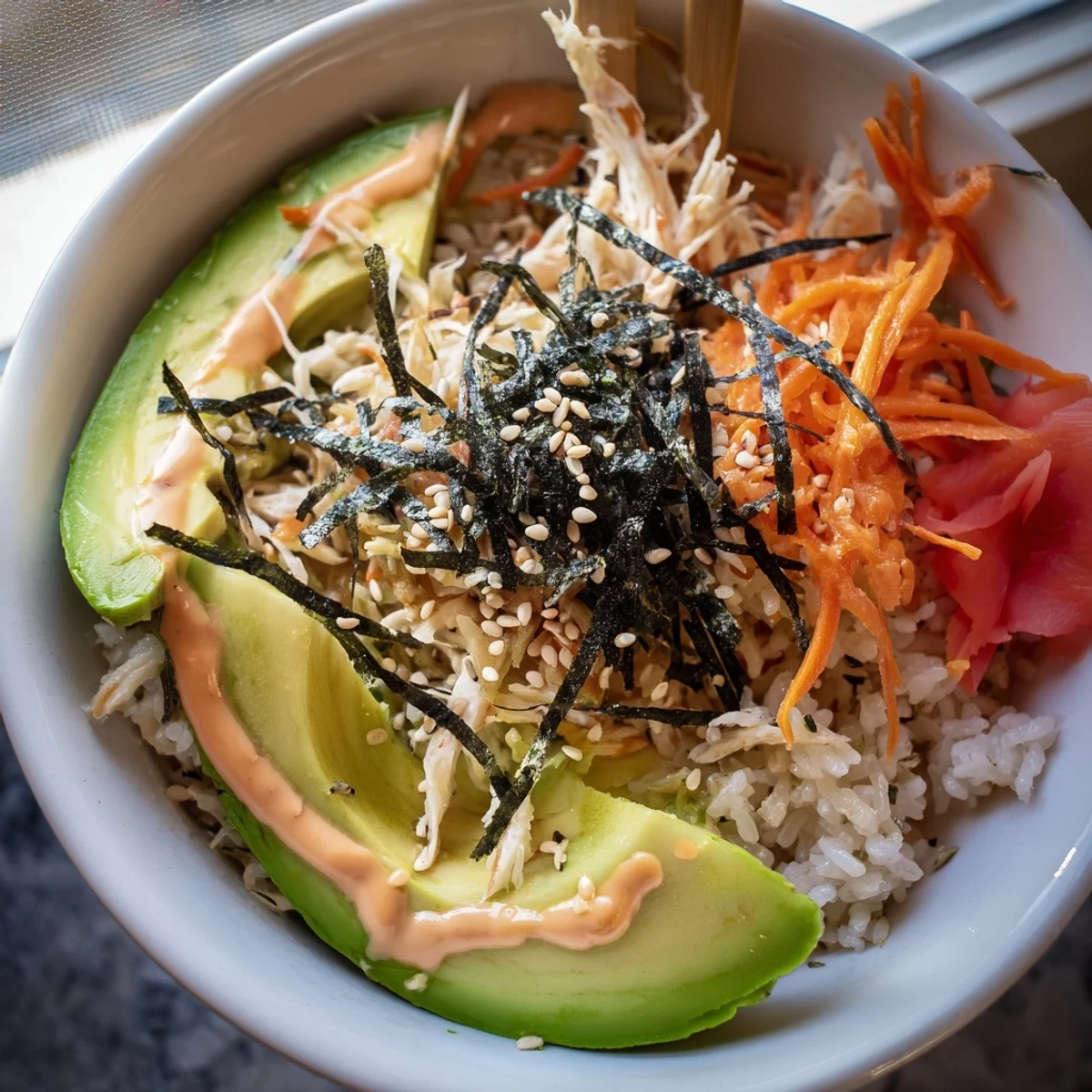 California Roll Sushi Bowls with creamy avocado, shredded crab, and sesame crunch