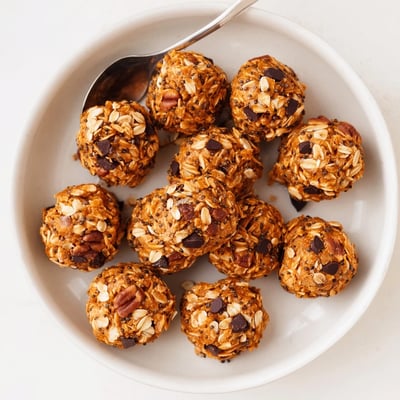 Chewy no bake pumpkin protein balls flecked with chocolate chips and warm spices
